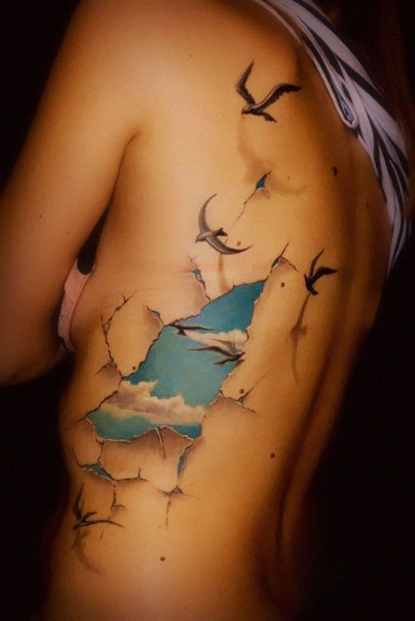 Birds flying out of her body