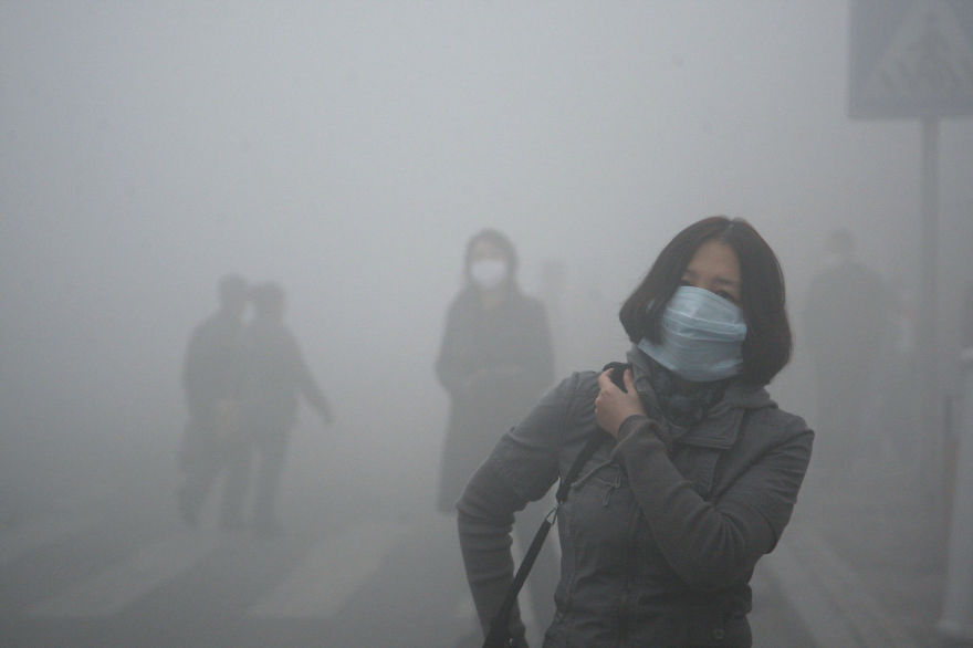 16. Girl Walks Through Smog In Beijing