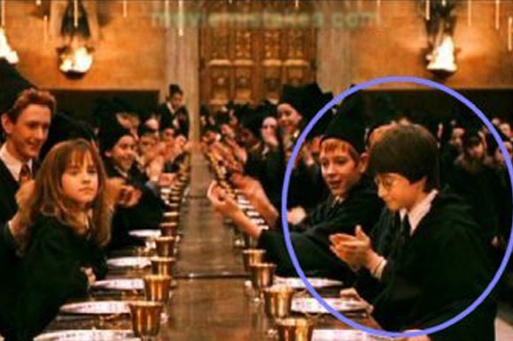 Harry moves to the other side of the table