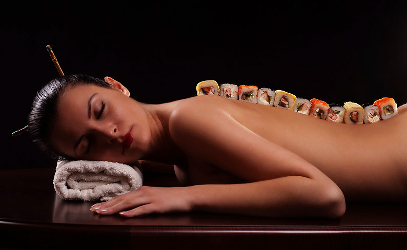 Models are used as sushi platters